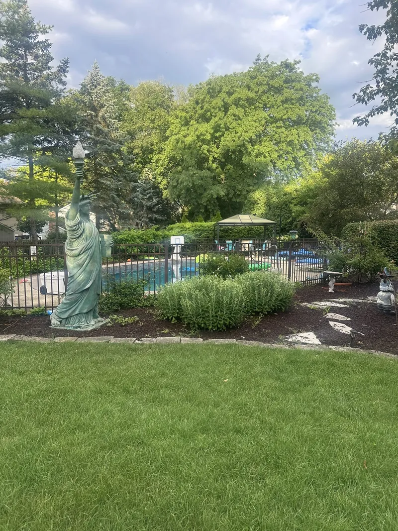 Manicured lawn and landscaped garden beds at an Aurora, IL home